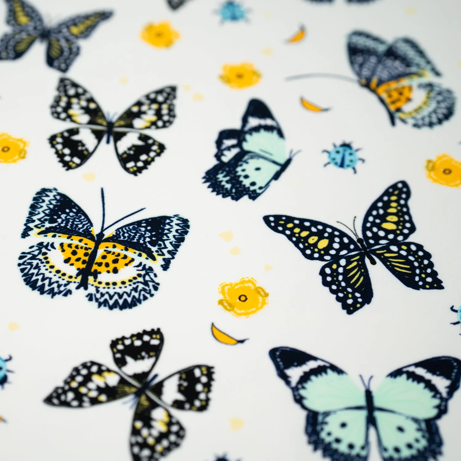 Butterflies and Ladybugs Printed Spandex Fabric | Blue Moon Fabrics