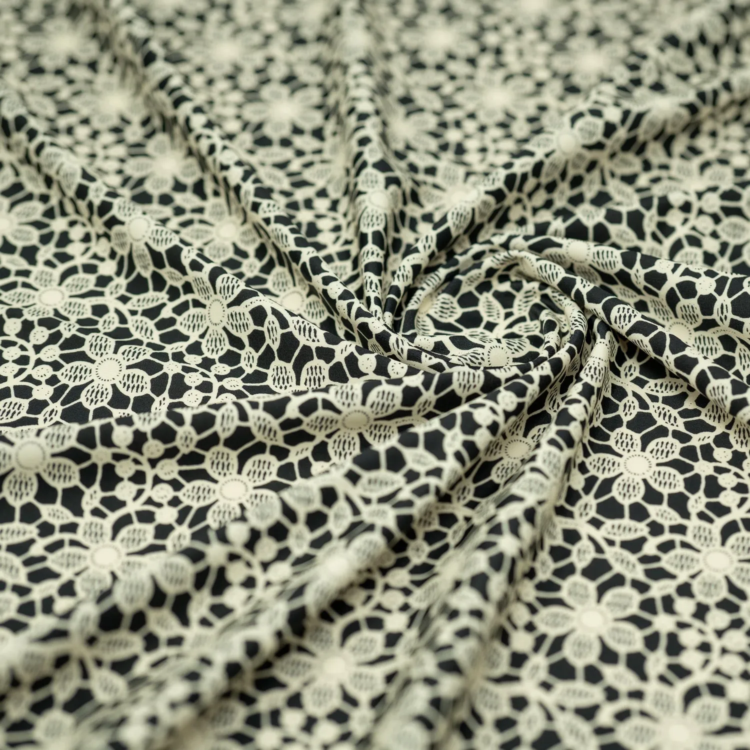 Ivory Flower Lace Pattern on Black Printed Spandex Fabric | Blue Moon Fabrics