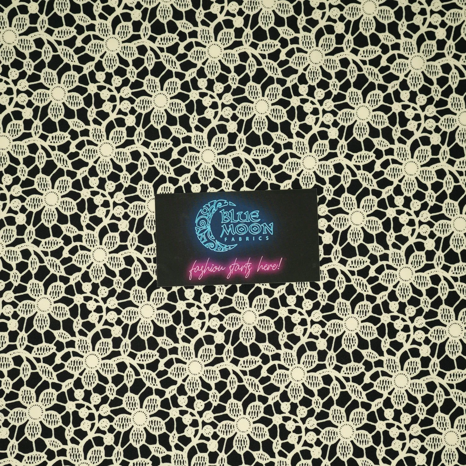 Ivory Flower Lace Pattern on Black Printed Spandex Fabric | Blue Moon Fabrics