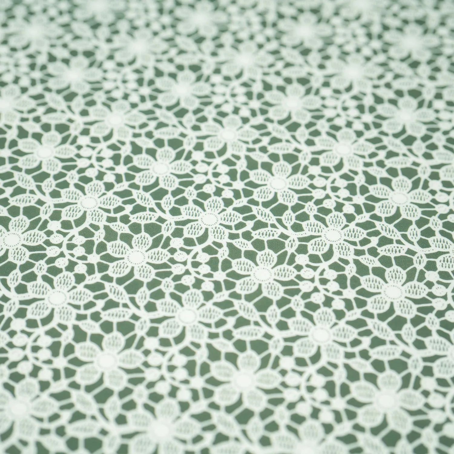 White Flower Lace Pattern on Sage Printed Spandex Fabric | Blue Moon Fabrics